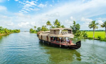 brown wooden boat on body of water during daytime