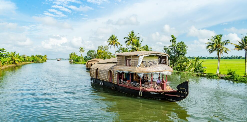 brown wooden boat on body of water during daytime